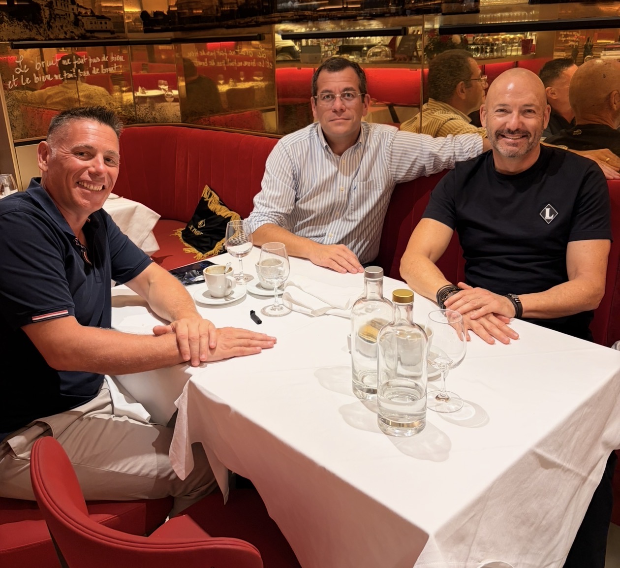 The three MonBleue co-founders at the restaurant table where the company was founded